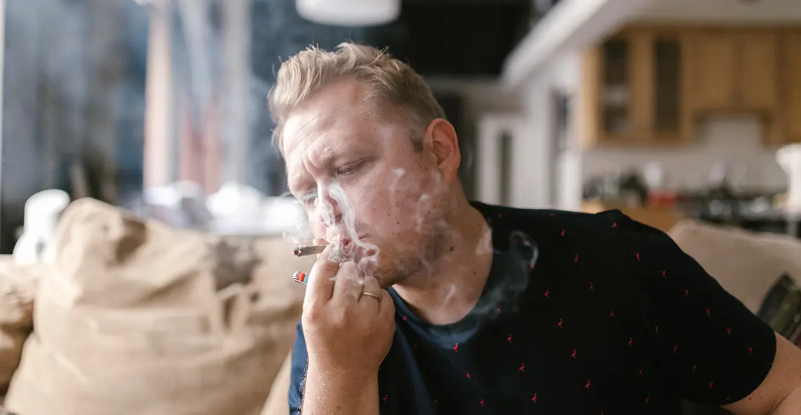 A man smoking Medical Cannabis to help with medical condition
